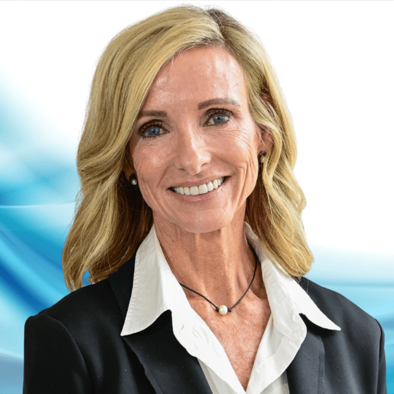Smiling businesswoman portrait in a black blazer and white blouse with a blue abstract background.
