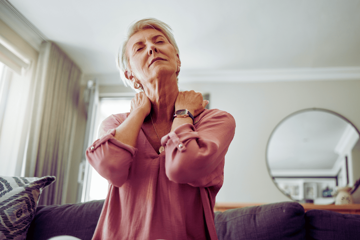 woman with fibromyalgia massages tender points on neck